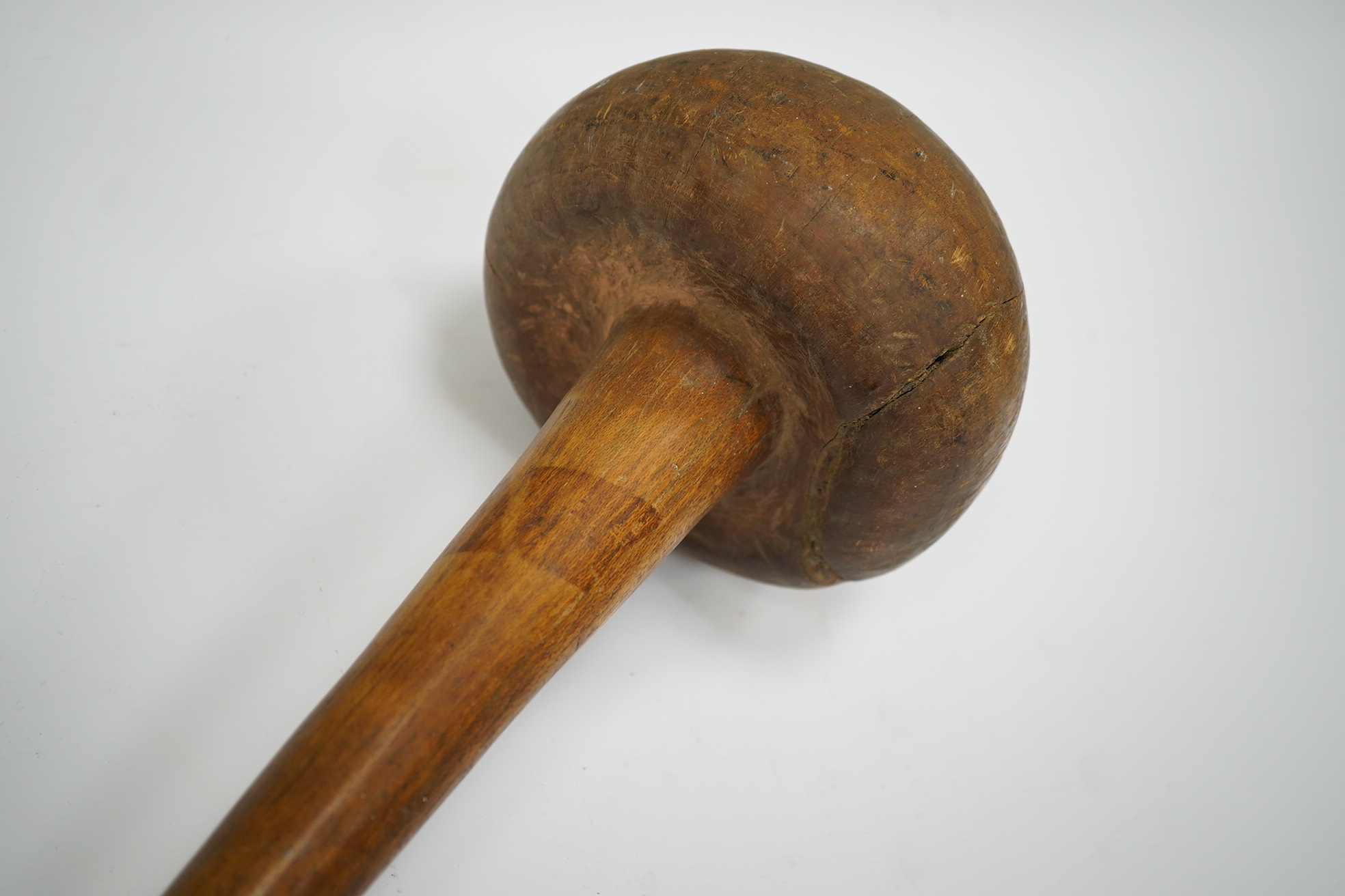 A Sudanese wooden Knobkerrie, approximately 62cm long, with profoundly swollen mushroom shaped head. Condition - poor to fair